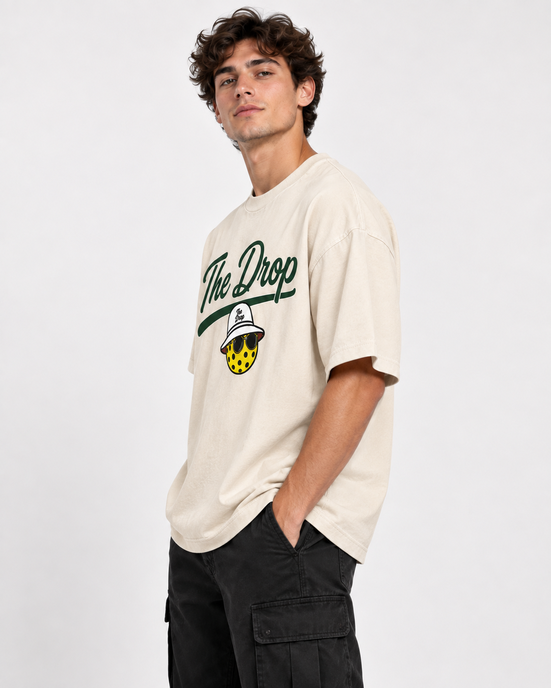 Model wearing The Drop Script Tee, angled view